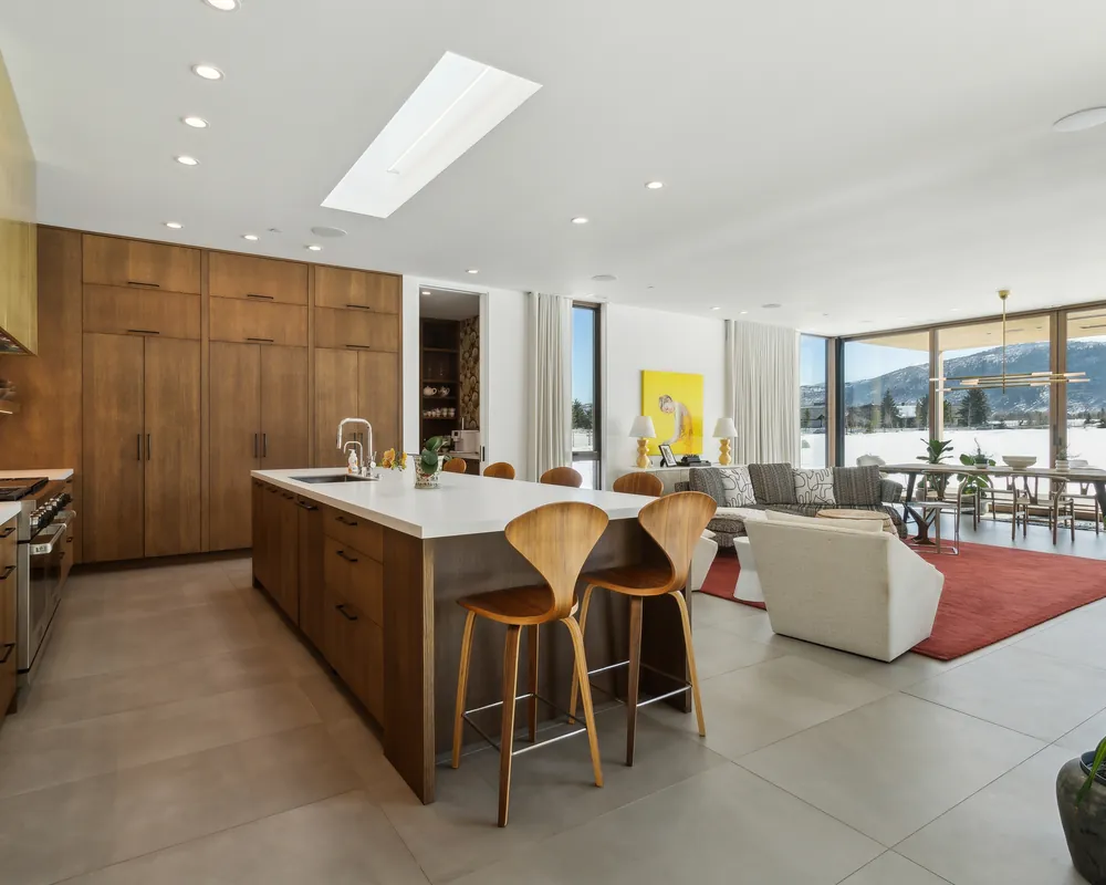 Chef’s kitchen with a walnut island and mountain views in a Park City home managed by Life Elevated
