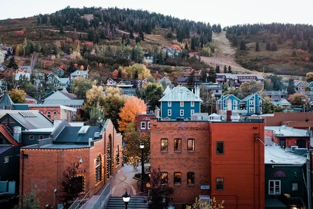 Historic Main Street in Park City, Utah, with ski runs on the mountainside above town
